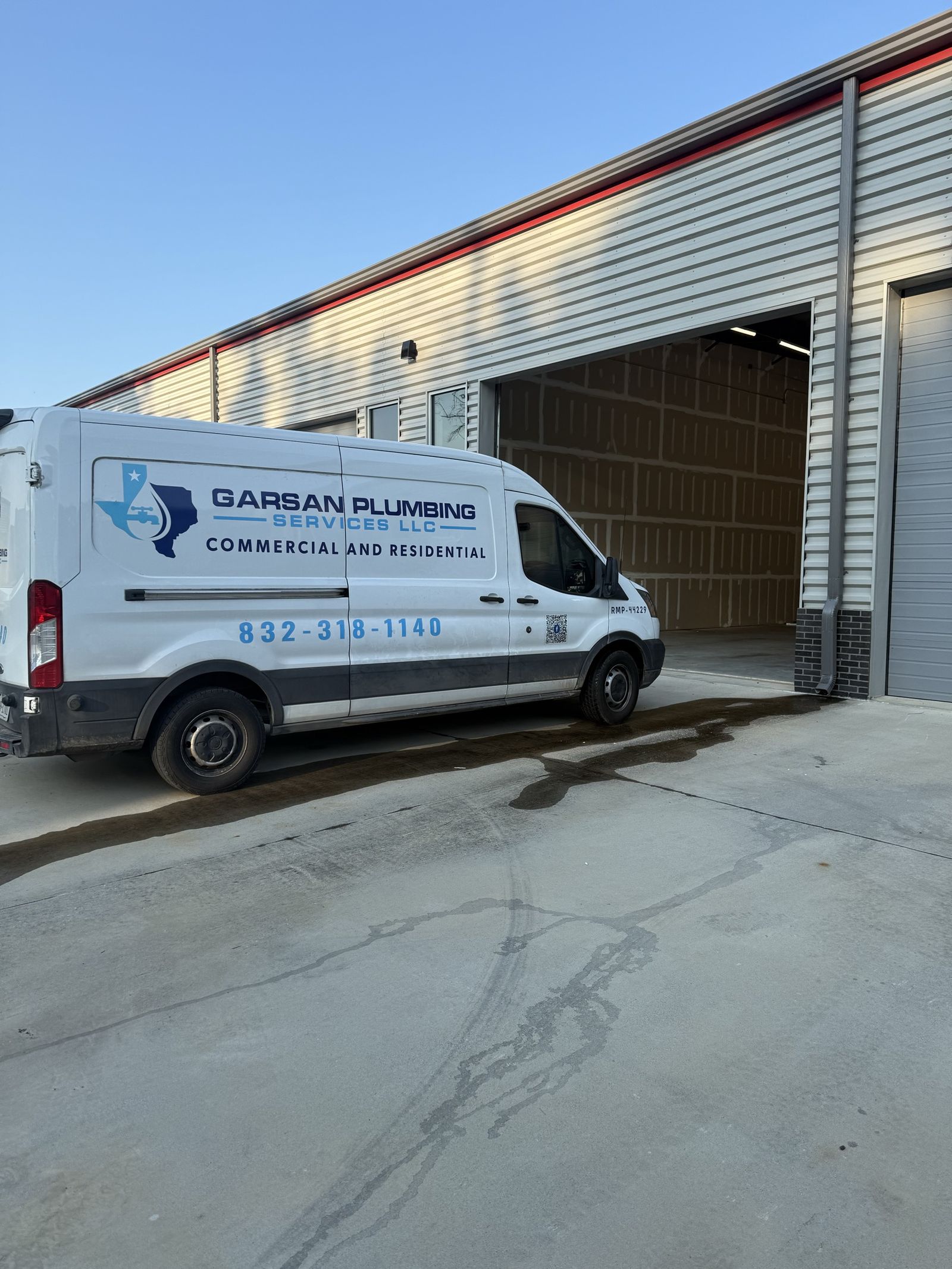 GarSan Plumbing Services work van on a job site